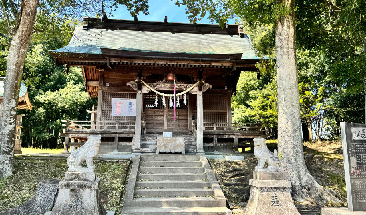 The wooden hall of worship among old trees