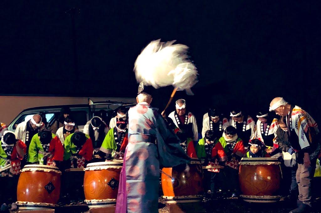 Local people drumming at a night festival