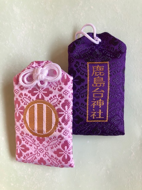 Omamori for good health, with the shrine's crest and name